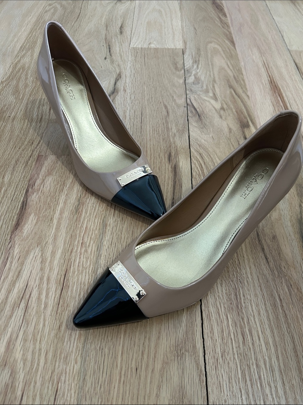 Coach Two-Tone Patent Pointed Toe Flats in Beige and Black with Gold Accent